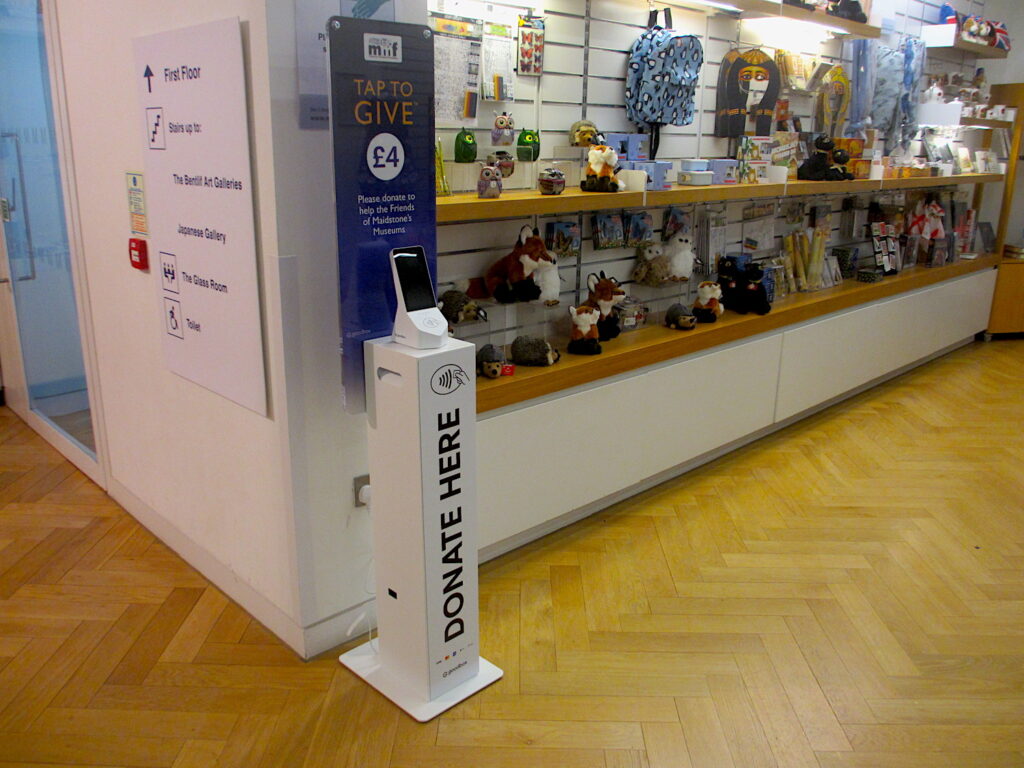 MMF contactless payment donation box in context